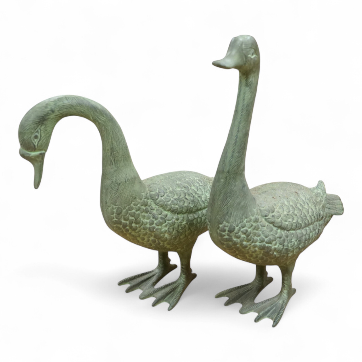 A pair of patinated spelter models of geese, 49cm
